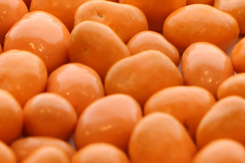 Apricots covered in a sweet milk chocolate confection.
