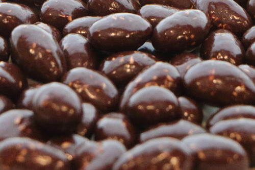Almonds coated in chocolate and coconut.